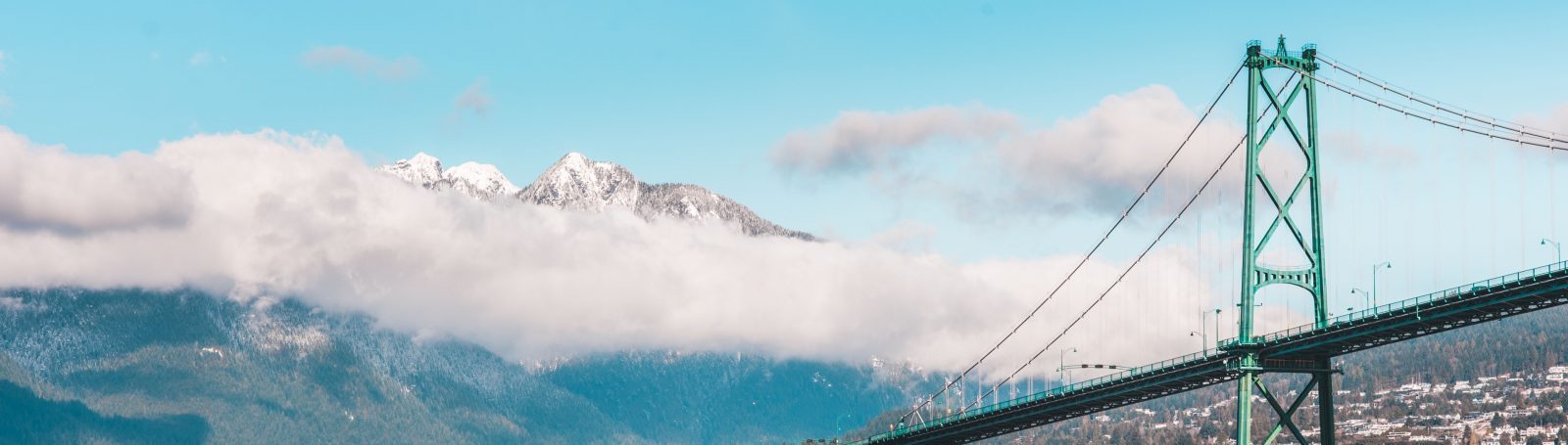Low angle of First Narrows Bridge overlooking the Mountains of Vancouver B.C.