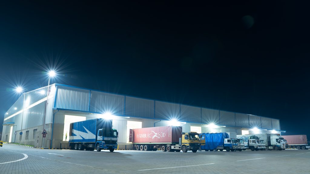 Loading cargo onto containers at night